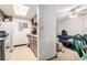 View of kitchen featuring cabinets, appliances, and view to living area at 2201 Sable Blvd # 1003, Aurora, CO 80011