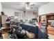 View of cluttered living room with ceiling fan and natural light at 2201 Sable Blvd # 1003, Aurora, CO 80011
