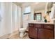 Cozy bathroom featuring a vanity with drawers, toilet, tub and shower combination at 2150 Wagon Way, Louisville, CO 80027