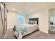 Basement bedroom with barn doors, recessed lighting, a window and earth tone accents at 2150 Wagon Way, Louisville, CO 80027
