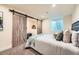 Basement bedroom features a large barn door closet, recessed lighting and a cozy atmosphere at 2150 Wagon Way, Louisville, CO 80027