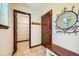 Functional entryway featuring a coat rack, mirror, and shelving for organized storage at 2150 Wagon Way, Louisville, CO 80027
