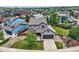 Two-story home with an attached garage, manicured lawn, and charming landscaping at 2150 Wagon Way, Louisville, CO 80027