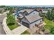 Two-story home featuring a two-car garage, neutral siding, and well-maintained landscaping at 2150 Wagon Way, Louisville, CO 80027
