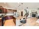 Spacious kitchen featuring an island with seating, stainless steel appliances, and hardwood floors at 2150 Wagon Way, Louisville, CO 80027