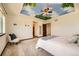 Serene main bedroom with a ceiling mural, and warm interior lighting at 2150 Wagon Way, Louisville, CO 80027