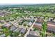 A high angle shot shows a well maintained neighborhood with mature trees and manicured lawns at 2150 Wagon Way, Louisville, CO 80027