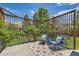 Stylish patio features modern furniture, privacy screen, and lush green plants at 2150 Wagon Way, Louisville, CO 80027