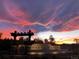 Steel Ranch community entrance sign showcased against a dramatic, colorful sunset at 2150 Wagon Way, Louisville, CO 80027