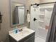 Updated bathroom featuring sleek vanity, framed mirror, and walk-in shower at 2636 Scoter Ln, Castle Rock, CO 80104