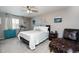 Comfortable bedroom featuring a ceiling fan, a cozy chair and clean, neutral decor at 2636 Scoter Ln, Castle Rock, CO 80104