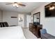 Spacious primary bedroom with neutral tones, carpeted floor, and a view of the en suite bathroom at 2636 Scoter Ln, Castle Rock, CO 80104