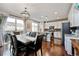 Dining and kitchen area with granite counters, stainless appliances, and wood flooring at 2636 Scoter Ln, Castle Rock, CO 80104