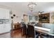 Open-concept dining room adjacent to living area featuring stylish décor and dark hardwood flooring at 2636 Scoter Ln, Castle Rock, CO 80104