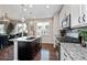 Well-equipped kitchen with an island, stainless steel appliances, granite countertops, and hardwood flooring at 2636 Scoter Ln, Castle Rock, CO 80104