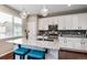 Beautiful kitchen with granite countertops, stainless steel appliances, and stylish pendant lighting at 2636 Scoter Ln, Castle Rock, CO 80104