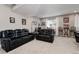 Comfortable living room featuring leather sofas, office space, and natural lighting at 2636 Scoter Ln, Castle Rock, CO 80104
