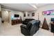 Basement living room has comfortable leather seating and modern decor at 2636 Scoter Ln, Castle Rock, CO 80104