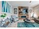Comfortable living room featuring a fireplace, mounted TV, accent furniture, and stylish décor at 2636 Scoter Ln, Castle Rock, CO 80104