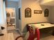 Basement rec room with air hockey, nearby bathroom, and adjacent office area at 2636 Scoter Ln, Castle Rock, CO 80104