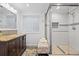 Bathroom features a stand up shower and stylish vanity at 19616 E Pinewood Dr, Aurora, CO 80016