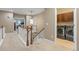 Hallway with staircase leading to the second floor, featuring a laundry room at 19616 E Pinewood Dr, Aurora, CO 80016