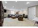 Spacious living room with comfortable seating, recessed lighting, and a neutral color palette at 19616 E Pinewood Dr, Aurora, CO 80016