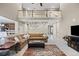 Spacious living area with an open floor plan, comfortable seating, and staircase access at 19616 E Pinewood Dr, Aurora, CO 80016
