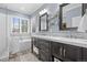 Bright bathroom with double vanity, walk-in shower, a freestanding tub, and mosaic tile accents at 19616 E Pinewood Dr, Aurora, CO 80016