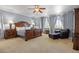 Large main bedroom features ceiling fan, carpeting, and natural light at 19616 E Pinewood Dr, Aurora, CO 80016