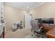 Bright home office with built-in shelving, ample desk space, and natural light at 19616 E Pinewood Dr, Aurora, CO 80016