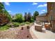 Beautiful backyard featuring a rock garden, pond, and a cozy outdoor seating area perfect for relaxation at 222 S Olive St, Denver, CO 80230