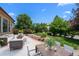 Charming backyard patio with outdoor seating and lush landscaping offering a serene retreat at 222 S Olive St, Denver, CO 80230