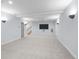 Finished basement with tv and modern lighting at 222 S Olive St, Denver, CO 80230