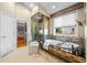Elegant bathroom featuring a soaking tub, glass shower, and access to a walk-in closet at 222 S Olive St, Denver, CO 80230