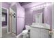 This bathroom offers a standing shower, decorative tile, and a marble countertop at 222 S Olive St, Denver, CO 80230