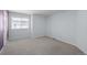 Spacious bedroom with neutral carpet and walls at 222 S Olive St, Denver, CO 80230