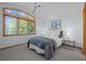 Bright bedroom with a large window and neutral decor at 222 S Olive St, Denver, CO 80230