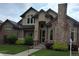 Traditional home with brick accents, manicured landscaping, and inviting front entry at 222 S Olive St, Denver, CO 80230