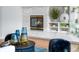 Close-up of a marble fireplace with gold trim, flanked by decorative shelves and accessories at 222 S Olive St, Denver, CO 80230
