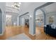 Elegant foyer with high ceilings, staircase, and hardwood floors at 222 S Olive St, Denver, CO 80230