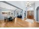 Spacious living area featuring hardwood floors and light-filled entry at 222 S Olive St, Denver, CO 80230