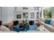 Stylish living room featuring a marble fireplace, cozy furniture, and elegant decor at 222 S Olive St, Denver, CO 80230