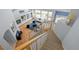 Open living room viewed from above with fireplace and large windows overlooking the backyard at 222 S Olive St, Denver, CO 80230