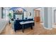 Comfortable living area featuring a fireplace, blue sofa and hardwood floors at 222 S Olive St, Denver, CO 80230