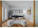 Home office with hardwood floors, decorative mirrors, and a French door at 222 S Olive St, Denver, CO 80230