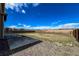 Expansive backyard with great sunny skies, a patio, and fenced boundary at 2325 Mountain Sky Dr, Fort Lupton, CO 80621