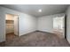 Neutral bedroom featuring plush carpeting, closet, and access to the rest of the home at 2325 Mountain Sky Dr, Fort Lupton, CO 80621