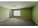 Bedroom featuring neutral carpet, large windows, and a tranquil, bright space at 2325 Mountain Sky Dr, Fort Lupton, CO 80621