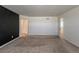 An inviting bedroom featuring neutral carpeting, closet and ensuite bathroom access at 2325 Mountain Sky Dr, Fort Lupton, CO 80621